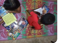 Children reading Brain Boost Books at home